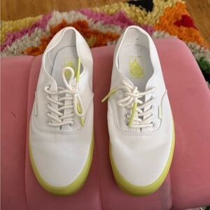 White vans with neon soles.